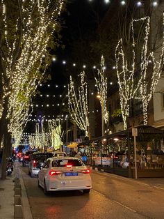 a street in madrid with christmas lights and a taxi waiting in the line Winter Aesthetic, Christmas Lights, Christmas Time, Things To Do, Lighting