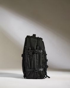 Make a seamless transition from weekdays to weekends with our Discovery Backpack. Offering a generous 28L packing capacity for work, play and every journey in between, the streamlined back-sleeve slots over your suitcase handle for hands-free carrying. Crafted from fully recycled polyester, this lightweight and durable travel companion features twisted ripstop reinforcement, ensuring it withstands the rigors of daily travel and water-resistant protection for peace of mind in wet weather. Designe Large Capacity Nylon Backpack For Trip, Nylon Laptop Bag Backpack With Large Capacity, Nylon Laptop Backpack With Large Capacity, Nylon Laptop Bag With Large Capacity, Large Capacity Nylon Laptop Backpack, Nylon Laptop Backpack With Luggage Sleeve, Nylon Backpack With Luggage Sleeve For Daily Use, Nylon Travel Backpack With Luggage Sleeve, Black Nylon Laptop Bag For Daily Use