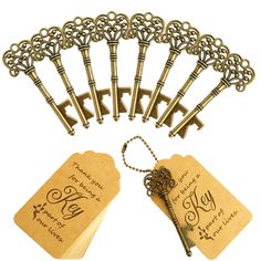 a bunch of keys that are sitting on top of a keychain and some tags