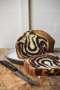 a loaf of chocolate swirl bread on a plate