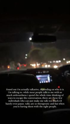 an image of the inside of a car at night, with text on the dashboard