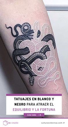 a black and white snake tattoo on the arm