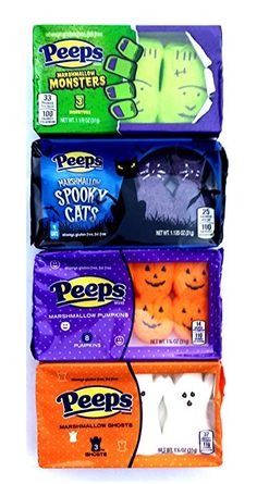 four halloween candy bars stacked on top of each other with ghost faces and cats in them