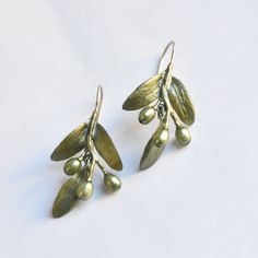 Olive Leaf Drop Earrings - Goldmakers Fine Jewelry Hand Forged Green Drop Earrings, Green Brass Earrings Nature-inspired, Artisan Green Brass Earrings, Unique Hand Forged Green Earrings, Artistic Green Metal Earrings, Green Oxidized Finish Earrings For Gift, Green Brass Earrings With Wire Wrapping, Green Oxidized Drop Earrings, Green Earrings With Oxidized Finish