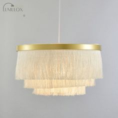 Introducing the Vittoria Gold Fringe Gold Ceiling Light Layered 1-Light Minimalism Hanging Lamp, a statement piece that will elevate your living room's ambiance. This exquisite lamp features a sleek gold finish with delicate fringe detailing, adding a touch of luxury and sophistication to any space. The layered design effortlessly creates a captivating visual effect, casting a warm and inviting glow throughout the room. Crafted with attention to detail, the minimalistic yet stylish silhouette perfectly blends with modern or traditional interiors. Whether you are hosting guests or enjoying a quiet evening at home, this hanging lamp provides the perfect lighting solution to create a cozy and elegant atmosphere. Enhance your living room decor with the Vittoria Gold Fringe Gold Ceiling Light L Living Room Pendant Light, Gold Ceiling Light, Gold Ceiling, Gold Fringe, Lamp For Living Room, Room Ambiance, Hanging Fixture, Gold Number, Traditional Interior