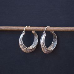 A fine example of traditional Nevari people hand formed silver hoops Approximately 1.5 inches in diameter Sterling Silver Oxidized Hoop Earrings For Festivals, Sterling Silver Hoop Earrings With Oxidized Finish For Festivals, Oxidized Sterling Silver Hoop Earrings For Festivals, Traditional Engraved Round Hoop Earrings, Artisan Silver Round Hoop Earrings, Traditional Engraved Hoop Earrings, Traditional Sterling Silver Engraved Earrings, Traditional Engraved Sterling Silver Earrings, Traditional Small Hoop Sterling Silver Earrings