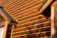 the side of a wooden building with an awning