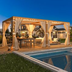 a backyard with a pool and gazebo covered in curtains at night, surrounded by lawn furniture