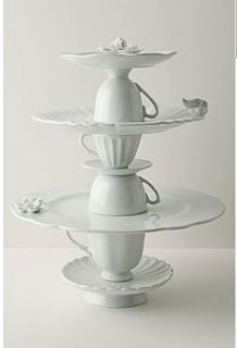 three tiered white cake stand with flowers on it