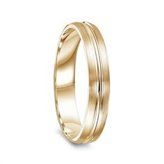 a yellow gold wedding ring with an elegant design in the center and two lines on each side