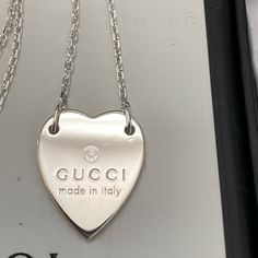 Authentic Gucci Heart Necklace In Sterling Silver 925. Classic Piece Comes With Original Box And Pouch. New Never Used. Pls See Pic For Details And Measurement. Chain Length Is About 18 Inches. Final Sales No Trade. Luxury Silver Heart Necklace With Heart Charm, Luxury Sterling Silver Open Heart Necklace, Luxury Sterling Silver Heart Charm Necklace, Luxury Silver Necklace With Hallmarks, Luxury Sterling Silver Heart Necklace, Luxury White Gold Necklace With Hallmarks, Luxury Heart Pendant Necklace, Elegant Sterling Silver Heart Necklace With Polished Finish, Luxury Open Heart Necklace With Polished Finish