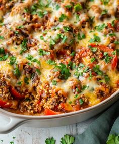 a casserole dish filled with meat and vegetables