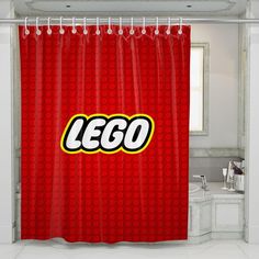 a red shower curtain with the word lego printed on it