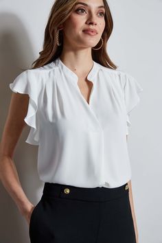 The soft cap sleeves lend a femme twist to this luxe georgette top. With its contour pleat detail neckline, it is perfect for layering with your favorite blazer or wearing on its own. T-Tahari Short Sleeve V-Neck Top Runs true to size. Model is 5'9" and wearing size S Dry Clean Only Imported Style #: THF44013 Elegant V-neck Top For Business Casual, Chic Formal Blouse With Ruffle Sleeves, Elegant Short Sleeve Tops For Office Wear, Elegant Sleeveless Blouse For Office, Chic Formal Tops With Ruffle Sleeves, Elegant Sleeveless Office Blouse, Elegant Sleeveless Tops For Business Casual, Elegant Ruffled Tops For Office, Elegant Flutter Sleeve Blouse For Work