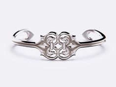 Introducing this exquisite Silver Cuff from the Fleur Romance Collection by Christopher Peter Designer Jewellery. Crafted by the artisan himself, this stunning piece embodies love and devotion with its elegant Fleur De Lis flowing into the embrace of a heart. Made from 925 sterling silver, this bracelet reflects the timeless beauty and sophistication of French Neo-Classical design from the age of enlightenment. Perfect for any occasion, this handcrafted masterpiece is a symbol of enduring romanc Elegant Cuff Bangle For Anniversary, Elegant Cuff Bangle For Formal Occasions, Elegant Formal Cuff Bangle, Elegant Adjustable Cuff Bracelet For Formal Occasions, Classic Intricate Cuff Bracelet For Formal Occasions, Luxury Adjustable Cuff Bracelet With Intricate Design, Elegant Cuff Wedding Jewelry, Elegant Cuff Jewelry For Weddings, Elegant Adjustable Cuff Bracelet