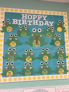 a bulletin board with frogs on it and the words happy birthday