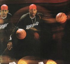 two men with red hats and basketballs in front of an advertisement for ice cream