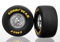 two black wheels with yellow lettering on them