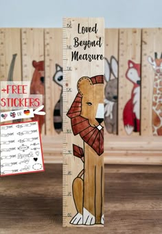 a wooden ruler with an image of a lion on it and the words free stickers