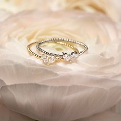 A modern and chic tiny heart design. Wear alone for a minimal look or stack with our other designs as pictured. Colors in: .925 Sterling Silver / Gold Vermeil Hypoallergenic, lead, and nickel free Heart Width: 5.5mm x Height:3.5mm Rope Band: 1mm #R098 Dainty White Gold Heart Ring, Elegant Everyday Silver Heart Ring, Delicate Stackable Heart Promise Ring, Dainty Adjustable Stackable Heart Ring, Dainty Stackable Heart Ring, Elegant Stackable Heart Charm Rings As Promise Ring, Elegant Adjustable Heart-shaped Stackable Rings, Dainty Heart Cut Birthstone Ring, Minimalist Heart Cut Stackable Rings