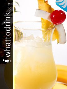 a pineapple drink garnished with a cherry