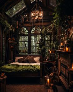 a bed sitting in a bedroom next to a window filled with plants and lit candles