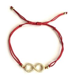 18k gold plated over 925 silver infinity bracelet .adjustable . for eternity,empowerment and everlasting love. --comes with free gift pouche. pulsera de infinito en 925 plata con baño de oro.rojo hilo. ajustable. para eternidad,empoderamiento y amor eterno. --gratis bolsa de regalo. Adjustable Infinity Friendship Jewelry, Gold Jewelry With Adjustable Cord For Valentine's Day, Gold Jewelry With Sliding Knot For Valentine's Day, Gold Jewelry With Adjustable Cord For Good Luck, Elegant Red Bracelets For Good Luck, Adjustable Bracelets As Gift For Her, Valentine's Day Jewelry With Adjustable Cord As Gift, Valentine's Day Adjustable Cord Jewelry Gift, Red Bracelet With Adjustable Chain As Gift