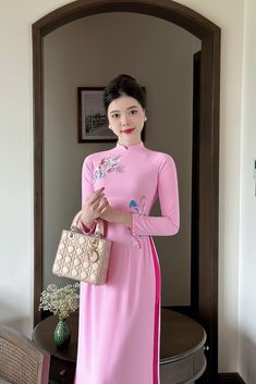 Vietnamese Ao Dai with sharp 3D printed motifs on silk fabric. Slim and lightweight design enhances the female figure. High quality silk material, slight stretch, very light and comfortable to wear. Elegant Pink Ao Dai With Floral Embroidery, Traditional Fitted Pink Ao Dai, Full Length Floral Embroidered Dress, Elegant Ao Dai With Floral Embroidery For Spring, Spring Floral Embroidered Ao Dai, Spring Floral Embroidery Ao Dai, Traditional Pink Ao Dai For Spring, Spring Embroidered Full Length Dress, Traditional Ao Dai With Floral Print