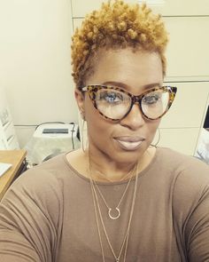 She looks a little like Mary J. Blige, I LOVE her glasses! Her makeup is gorgeous, too. Twisted Hair