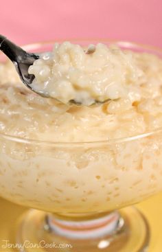 a spoon full of oatmeal in a glass bowl