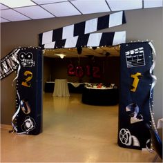 the entrance to an event decorated with black and white decorations