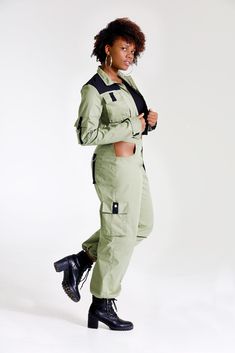 "Let them catch your vibe wearing this edgy pant set with matching jacket. This combo is crafted with cotton, mixed with denim, and designed with three pockets on the jacket, and three pockets on the pants, Cargo style! The jackets design is color blocked for that edginess it brings and the pants has a unique outer pocket on the left front and a half belt closure. Pair up this outfit with a cute bandeau top, or bodysuit and combat boots, Make all your friends wish they had this set too. All of o Fitted Cotton Parachute Pants With Pockets, Green Cotton Outerwear With Cargo Pockets, Fitted Cotton Utility Jacket For Streetwear, Fitted Utility Parachute Pants For Streetwear, Trendy Cotton Utility Jacket With Cargo Pockets, Fitted Khaki Utility Parachute Pants, Fitted Utility Jacket With Pockets, Fitted Utility Jacket With Patch Pockets, Green Utility Cargo Pants For Winter