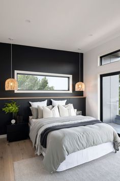 moody feature wall inside the Cayman 287 display home bedroom adds modernistic touch to an otherwise fresh and elegant house. white and grey bedding contrast with dark decor, overhead ledge for convenience, gorgeous horizontal window panel floods in light Bedroom Window Above Bed, Moody Feature Wall, Feature Wall With Window, Black Feature Wall, Feature Wall Bedroom, Caravan Interior