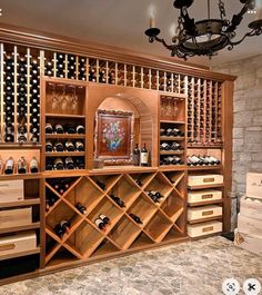 a wine cellar with many bottles and drawers