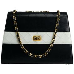 Chanel 1980s Two Tone Black and White Vintage Flap Bag | From a unique collection of rare vintage Structured Shoulder Bags at https://www.1stdibs.com/fashion/handbags-purses-bags/shoulder-bags/structured-shoulder-bags/. Classic Formal Double Flap Bag, Classic Flap Bag With Chain Strap, Classic Double Flap Evening Bag, Classic Evening Double Flap Bag, Classic Evening Shoulder Bag With Cc Turnlock Closure, Classic Flap Bag With Cc Turnlock Closure, Classic Double Flap Bag With Chain Strap, Classic Formal Flap Bag With Magnetic Closure, Vintage Rectangular Flap Bag For Evening