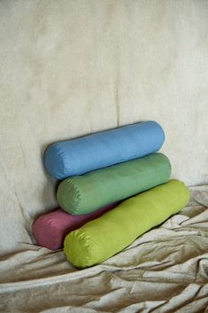 three pillows stacked on top of each other