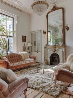 a living room with couches, chairs and a fire place in front of a mirror