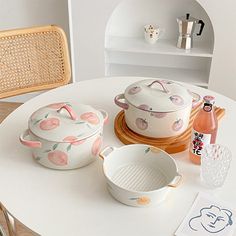 the table is set with dishes and utensils on it, including one for casserole