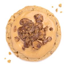 a cookie with peanut butter and chocolate chip cookies on it's center, surrounded by crumbs