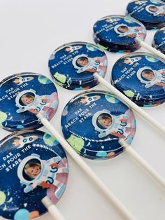 some toothbrushes with pictures of astronauts on them