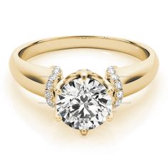 a yellow gold engagement ring with diamonds on it