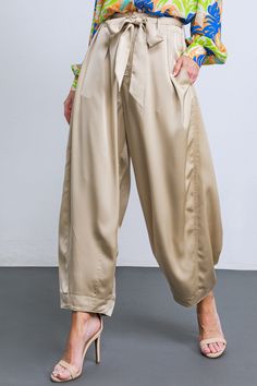 A solid woven satin pant featuring front closure, front pleats, side and back pockets, self sash tie, elasticized back waistband and tapered bottom. Crafted from luxurious woven satin, these POWERFUL CHARM WOVEN SATIN PANTS are perfect for any special occasion. A sash tie extends from a front pleat to a tapered bottom, providing a superbly tailored silhouette. Side and back pockets provide functional utility, while the elasticized back waistband ensures maximum comfort. Elevate any look with the Satin Formal Pants, Satin Pant, Silky Pants, Satin Pants, Christmas Outfits, Bridal Fashion, Matching Top, Indian Bridal, Ethiopia