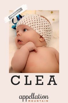 a baby is wearing a headband and laying on it's back with the name clea appellation mountain