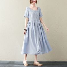 "FEATURES 55%linen, 45%cotton Medium Weight, Breathable and Washed Soft fabric Front button closure Square neck dress Half sleeve Loose waist, pleated details Midi calf dress Casual linen dress Perfect for Summer, spring Wash by hand or machine in cold water ★★ Model size Height 167cm (5′ 6″) Bust 84 cm (33\") Waist 66 cm (26\") She wears in size XS. ★★Bespoke Order Service If you Request other color Request the length Your height is not between 155 cm- 175 cm Your weight is not between 47 kg -7 Cotton A-line Dress With Buttons, Cotton A-line Midi Dress With Button Closure, Spring A-line Midi Dress With Button Closure, Casual A-line Maxi Dress With Buttons, Cotton A-line Dresses With Button Closure, Cotton Midi Dress With Buttons For Daywear, Vintage Midi Dress For Daywear In Spring, Cotton Button-up Sundress, Casual Linen Dress For Spring