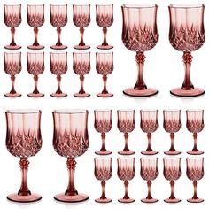 a set of twelve pink goblets sitting next to each other on a white background