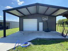 a garage with two basketball hoops in the front and one on the back side