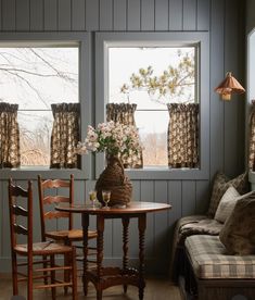 a living room filled with furniture and windows