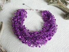 Purple sequin necklace, Bib bright necklace, Ultra violet necklace, Multistrand elastic necklace, Flexible jewelry, Statement thick necklace Bright purple airy crocheted necklace with sequine chips and glass seed beads. This necklace are not so logn and you can use it like multistrand beaded choker. A bright, beautiful and flexible piece of jewelry, it will be a great addition to an evening or a wedding gown. It might be a perfect gift for her for a birthday, anniversary or another occasion. Mea Purple Beaded Crystal Necklaces For Party, Handmade Purple Beaded Necklaces For Party, Purple Multi-strand Necklace For Party, Handmade Purple Beaded Necklace For Party, Purple Crystal Necklaces For Party, Purple Beaded Party Necklace, Bathroom Ornaments, Violet Necklace, Bright Necklace