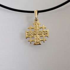 "Jerusalem cross necklace is made of solid gold, and it can be a beautiful, meaningful Birthday gift for a sister or mother since it fits equally adult woman or teenager. Choose the color of gold, and I'll gladly make this delicate openwork pendant for you. ● Pendant height with loop 0.96\" (2.4 cm) ● Width 0.68\" (1.7 cm) ● A black leather cord 18\" (45 cm) with goldfilled clasps is added. I can change the cord length by your choice. Please mention it when you make the order. ● You can additionally buy the gold chain here: https://etsy.me/3ERIIxI Follow me on Facebook: @Artleah.jewelry Welcome to my second shop with unique designer jewelry: www.etsy.com/shop/ArtleahBoutique Plan ahead! Each jewelry piece is made to order, with strict quality control and professional pride. This means you Yellow Gold Cross Necklace As A Gift, Yellow Gold Cross Necklace Gift, Yellow Gold Cross Necklace Pendant As Gift, 14k Gold Cross Pendant Necklace For Gift, Christian Jewelry For Women, Yellow Gold Cross Necklace, Black Leather Necklace, Expensive Jewelry Luxury, Gold Cross Necklace