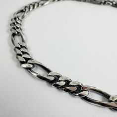 The Rosine bracelet made up of the forever timeless figaro chain. Material: 925 Sterling Silver Finish: Oxidised Silver Size: 19cm or 20cm long - 4.4mm wide Chain made in Italy, partly assembled and finished by us. Figaro Chains, Figaro Chain, Oxidized Silver, Snake Chain, Bracelet Making, Chain Bracelet, Silver Gold, Jewelry Collection, Jewelry Bracelets